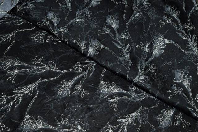 Vendita on line tessuto broccato fiore stilizzato fondo nero - tessuti abbigliamento poliestere fantasia